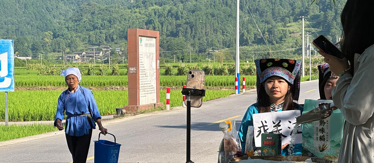 A farm influencer on a country road in China.