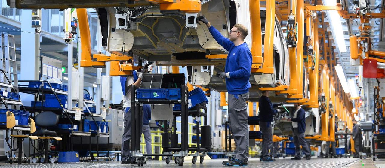 Employees assemble ID Buzz vehicles at the Volkswagen Commercial Vehicles factory. 