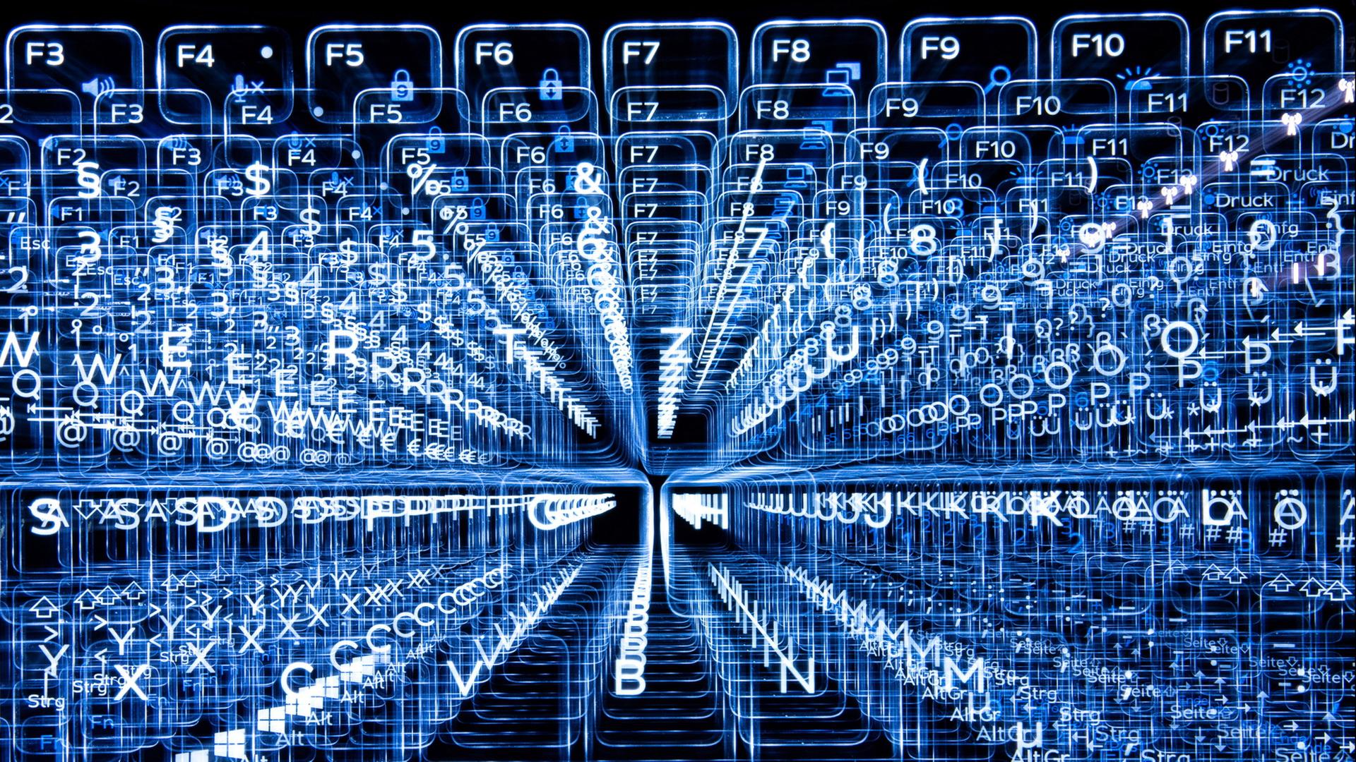 Tasten einer beleuchteten Tastatur, aufgenommen mit Zoomeffekt. | Sebastian Gollnow/dpa
