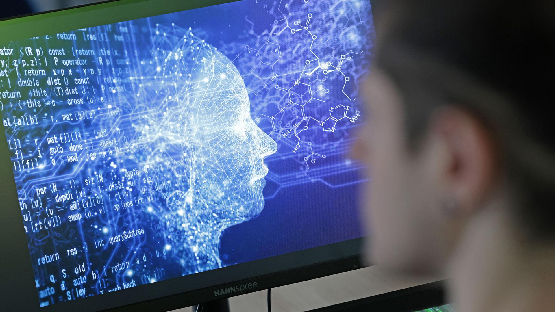 Ein Mann schaut auf einen Computerbildschirm, der Animation von künstlicher Intelligenz zeigt. | Matthias Bein/dpa