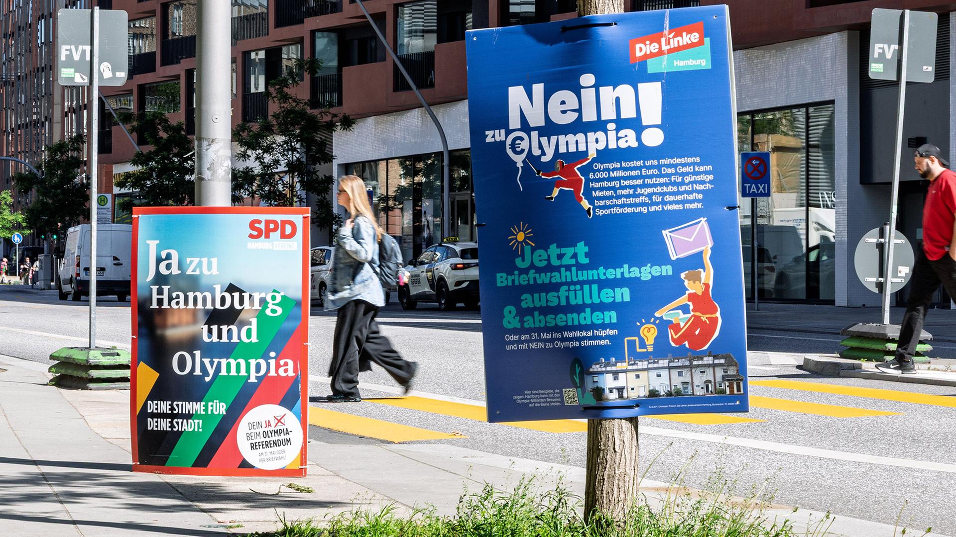 Zwei Plakate werben mit gegensÃ¤tzlichen Positionen zur Olympia-Bewerbung. | Markus Scholz/dpa