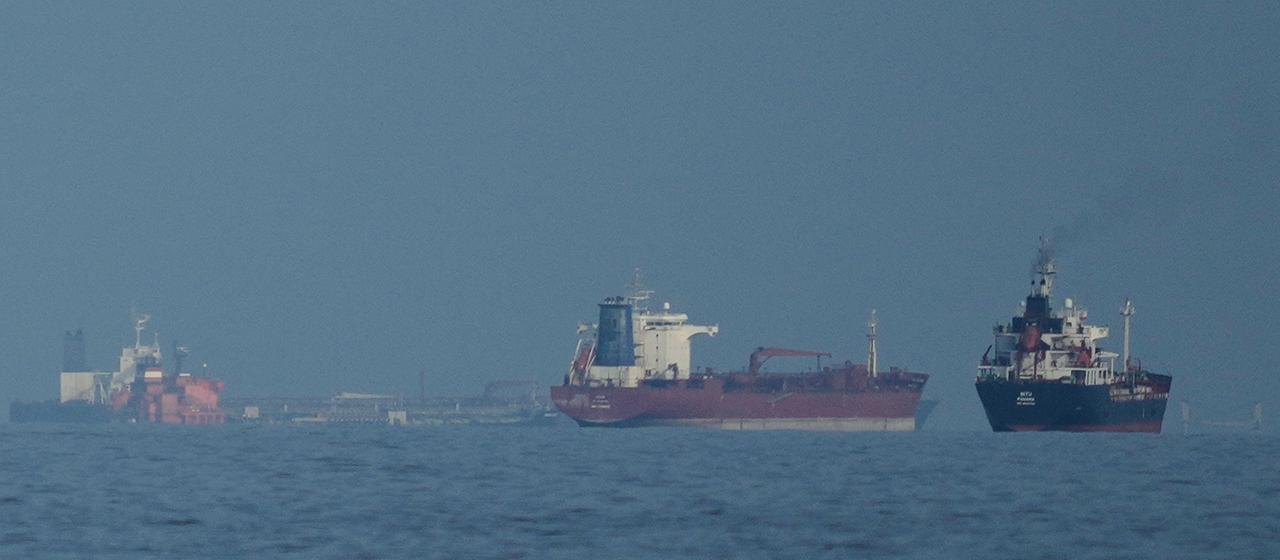 Oil tankers and cargo ships line up in the Strait of Hormuz