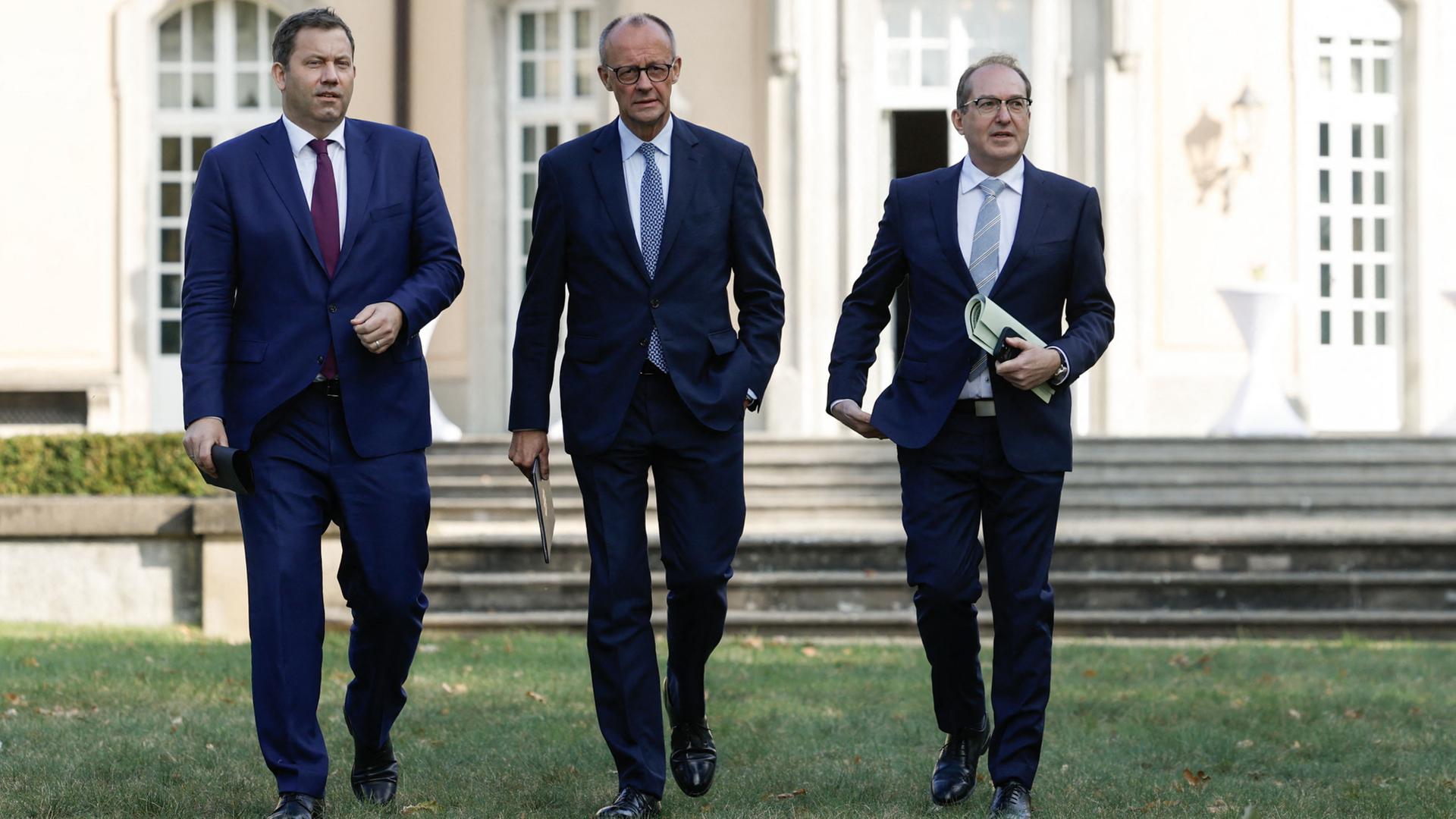 Lars Klingbeil, Friedrich Merz Alexander Dobrindt | AFP