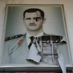 Damaskus: Ein zerrissenes Plakat zeigt den gestürzten syrischen Präsidenten Baschar al-Assad.