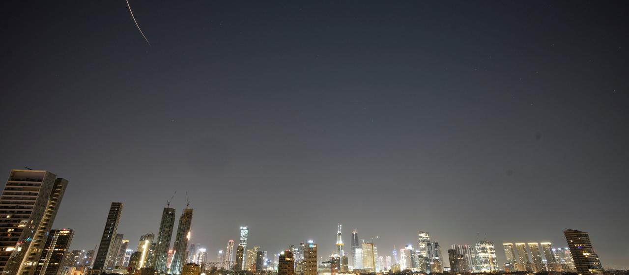 Missiles fired by Iran streak across the sky over Tel Aviv