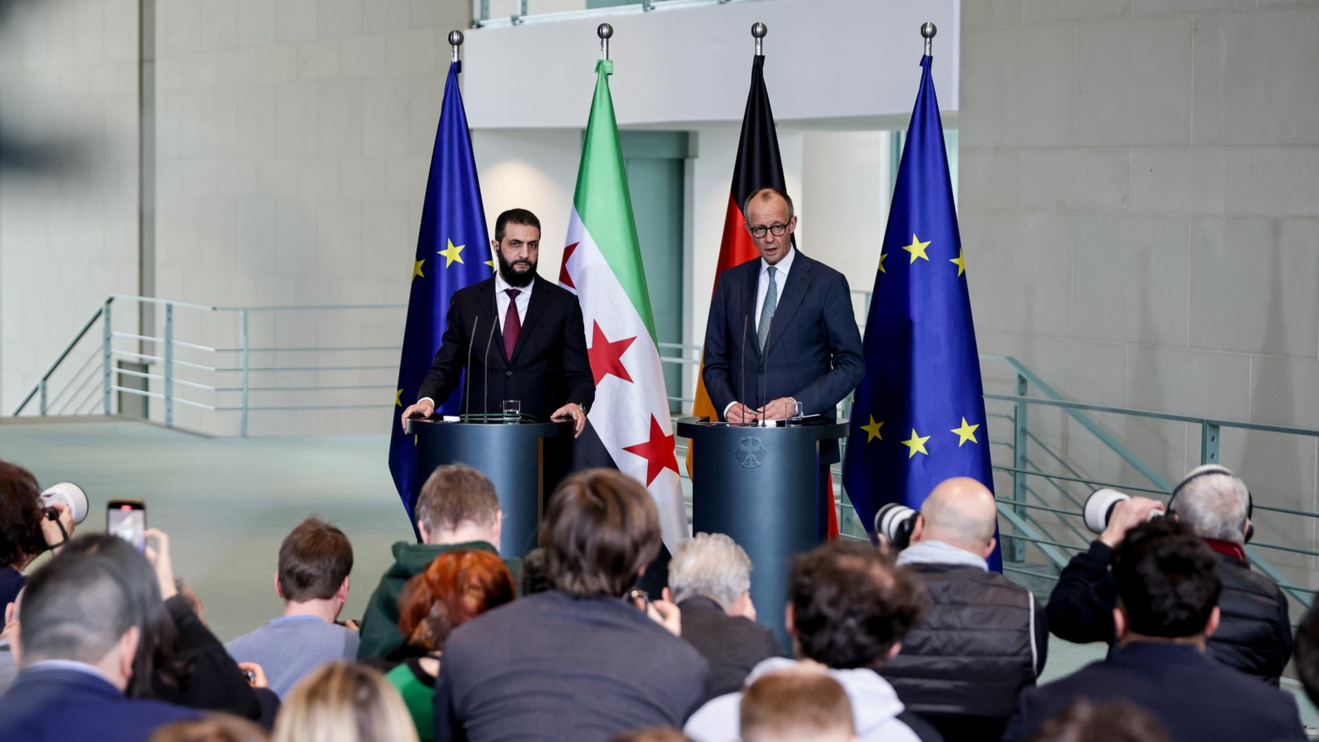 Al-Scharaa und Merz bei ihrem Auftritt vor der Presse | EPA