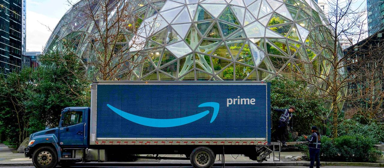 An Amazon Prime delivery truck is parked in front of The Spheres, at Amazon headquarters.