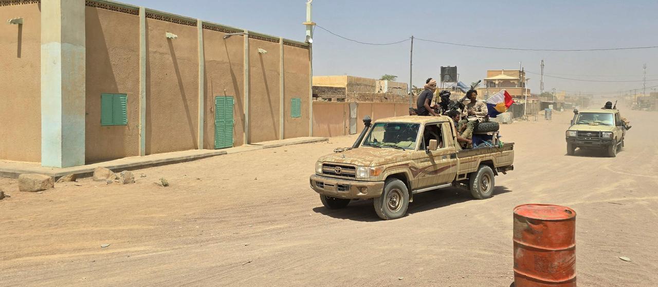 Tuareg rebels ride in the back of a pickup truck in Kidal. 