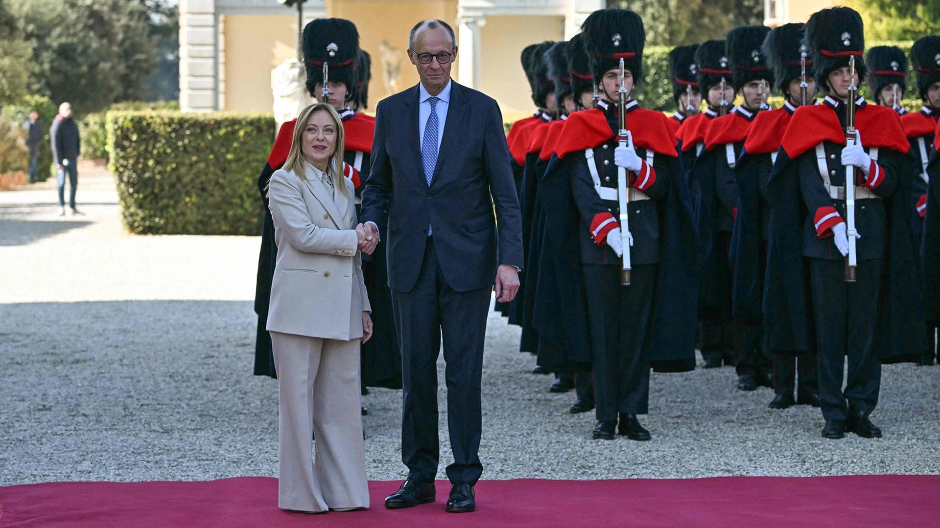 Giorgia Meloni und Friedrich Merz | AFP