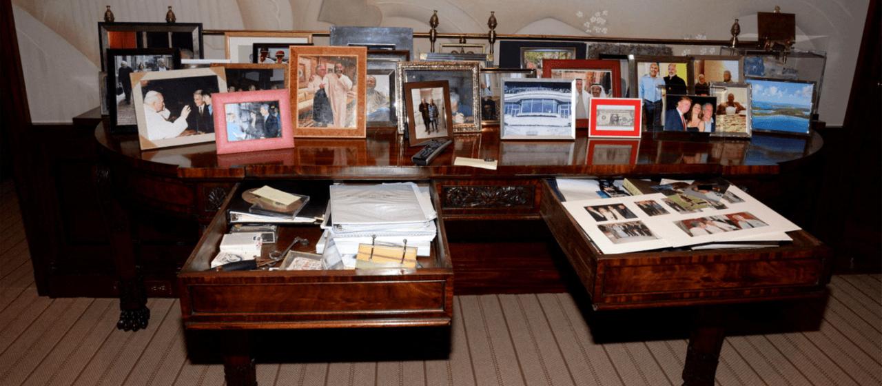 This photo from the Epstein Files images released by the U.S. Department of Justice shows a dresser with several framed photos on it. 
