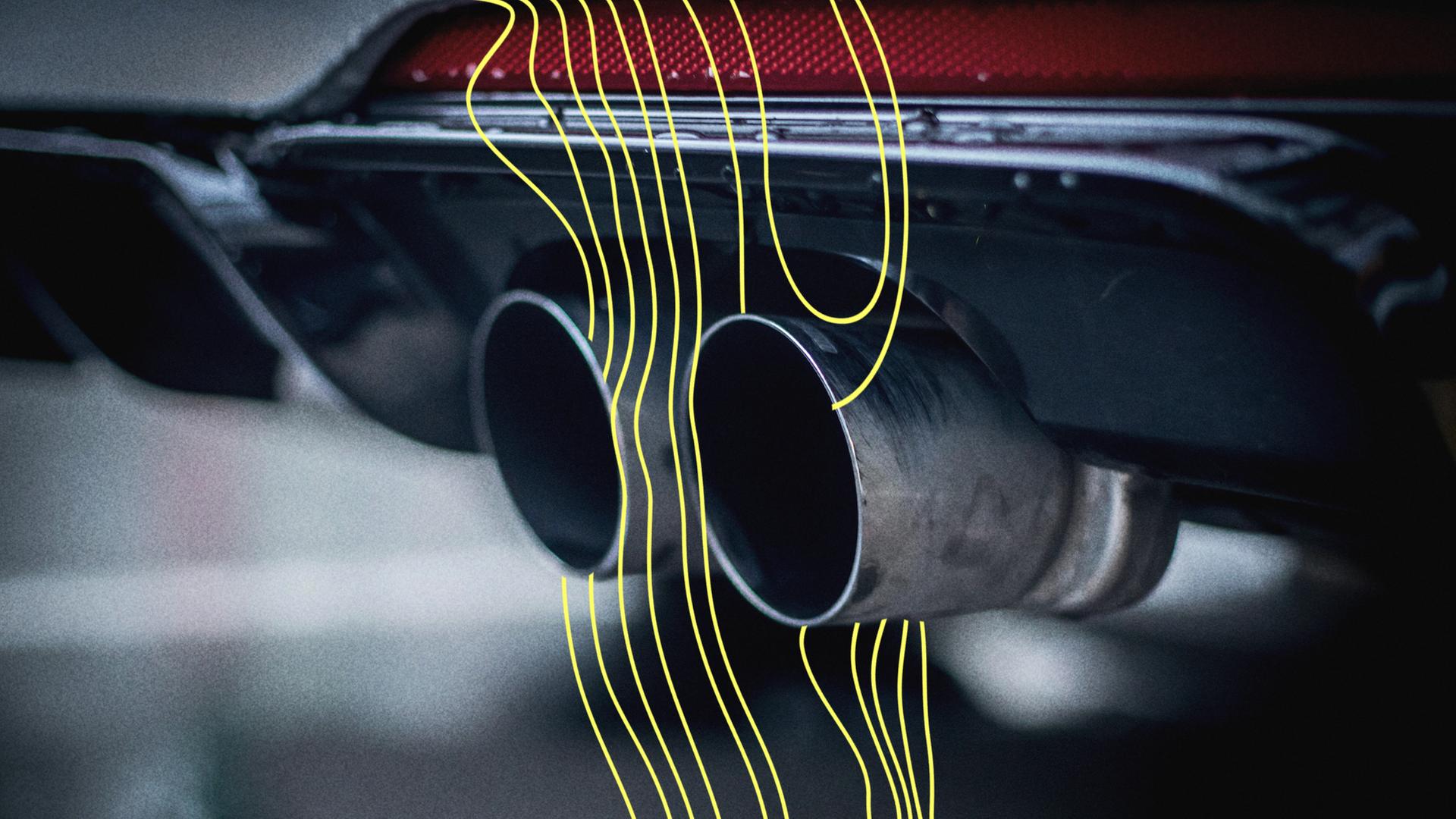 Blick auf die Auspuffrohre eines Autos. | picture alliance/ Zoonar | Patrick Daxenbichler
