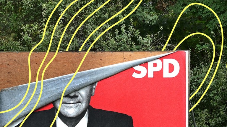 Ein SPD-Plakat mit einer Abbildung von Olaf Scholz. Das Plakat ist kaputt.
