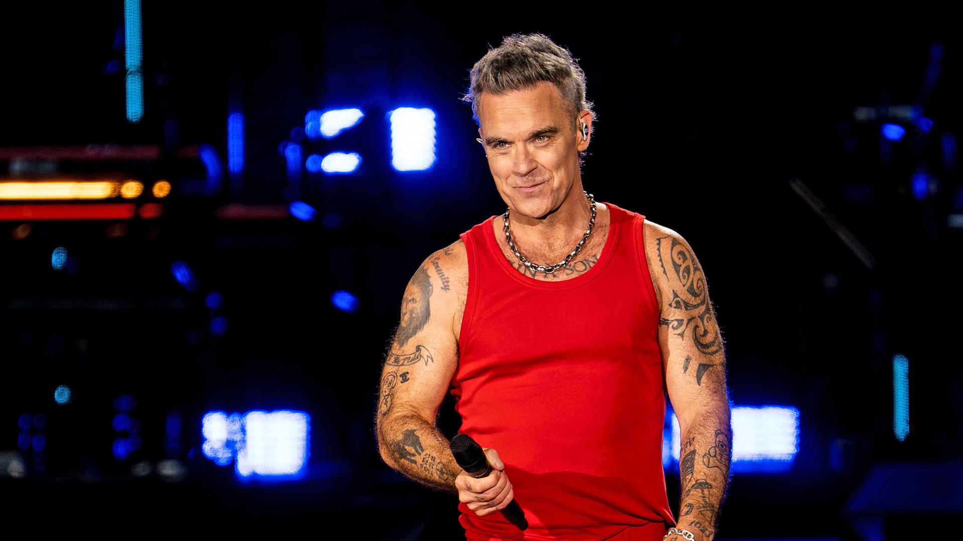Robbie Williams bei einem Konzert am 28.08.2026 (Quelle: picture alliance/NurPhoto/N.Cruz) | picture alliance/NurPhoto/N.Cruz