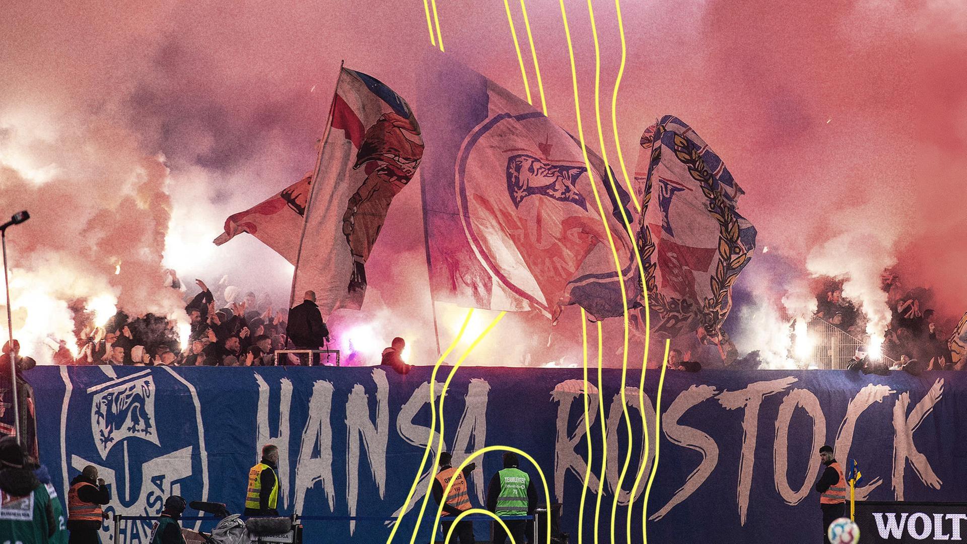Fußball: 2. Bundesliga, Eintracht Braunschweig - Hansa Rostock, 17. Spieltag, Eintracht-Stadion. Fans von Hansa Rostock zünden Pyrotechnik. | picture alliance/dpa, Swen Pförtner
