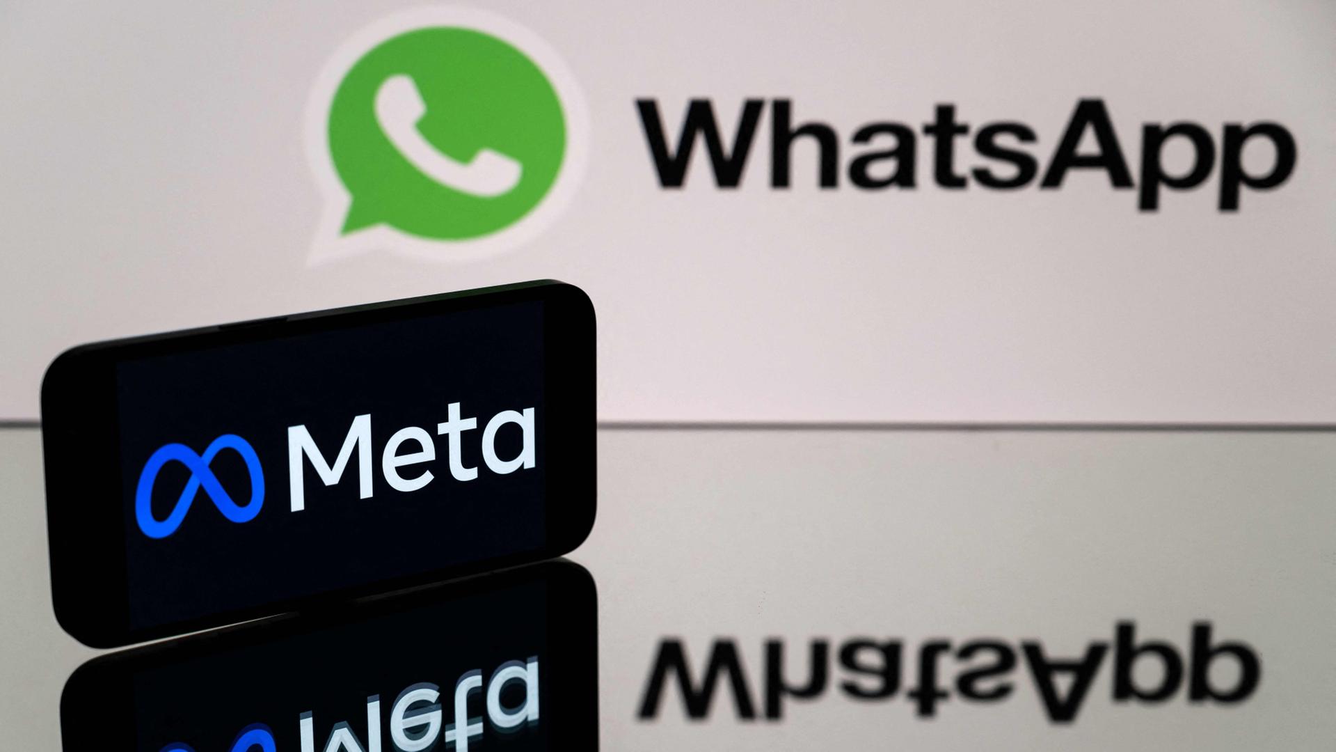 Das gr�ne Whatsapp- und das schwarze Meta-Logo untereinander | AFP