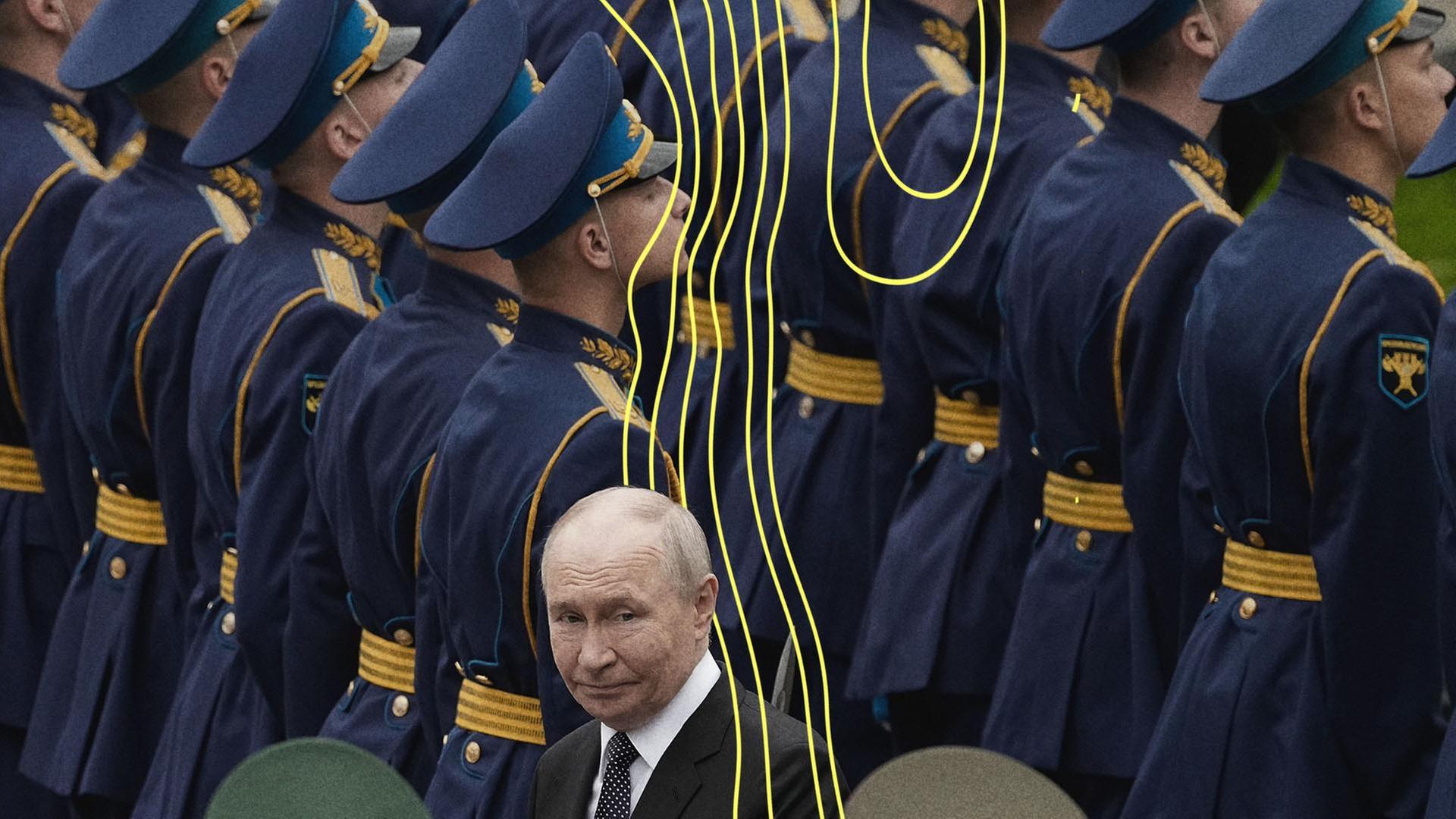 Putin steht zwischen einer Gruppe russischer Soldaten. | picture alliance / Alexander Zemlianichenko/POOL AP via AP