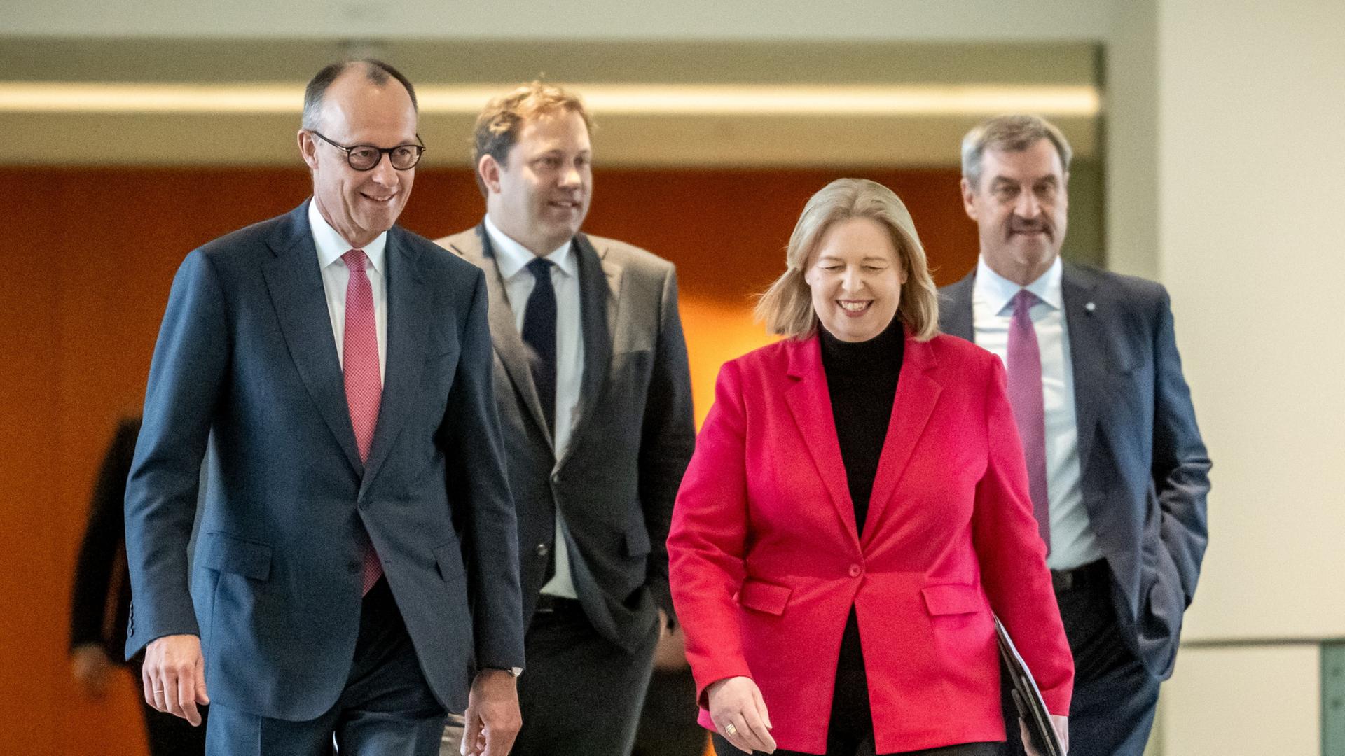 Friedrich Merz, Bärbel Bas, Markus Söder und Lars Klingbeil  | Michael Kappeler/dpa
