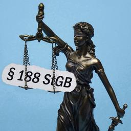 Das Modell der Justitia traegt den Schriftzug Paragraf 188 StGB.