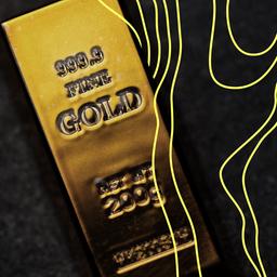 Goldbarren liegen auf einem Tisch.