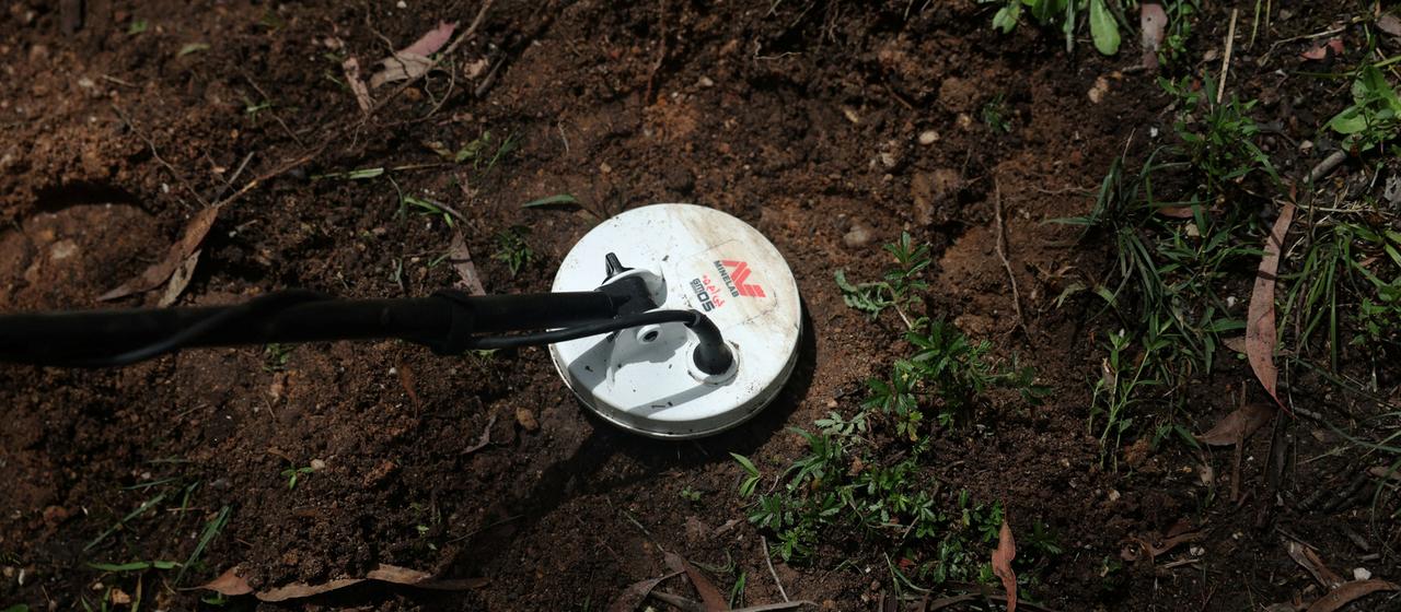 A metal detector is used to search for gold in Australia.