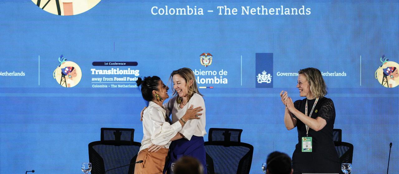 Irene Velez Torres (l) embraces Stientje van Veldhoven.