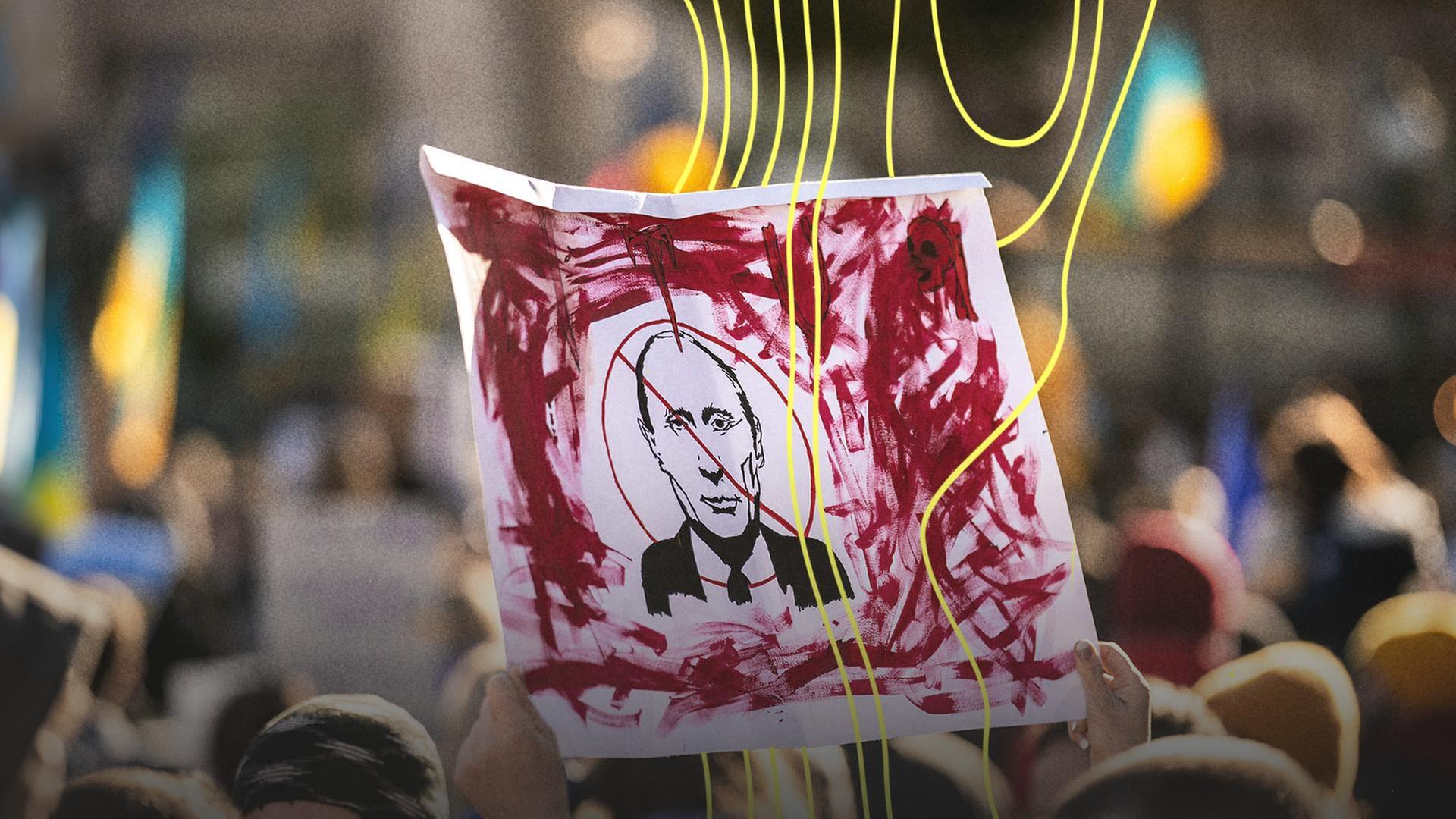 Auf einer Demonstration wird ein Plakat hochgehalten auf dem ein Bild von Putin durchgestrichen ist. | picture alliance / Hans Lucas, Xose Bouzas