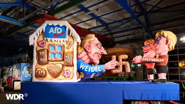 wdr-dieser-mottowagen-von-jacques-tilly-wurde-bereits-vor-rosenmontag-in-der-duesseldorfer-fernsehsitzung-praesentiert-100.webp