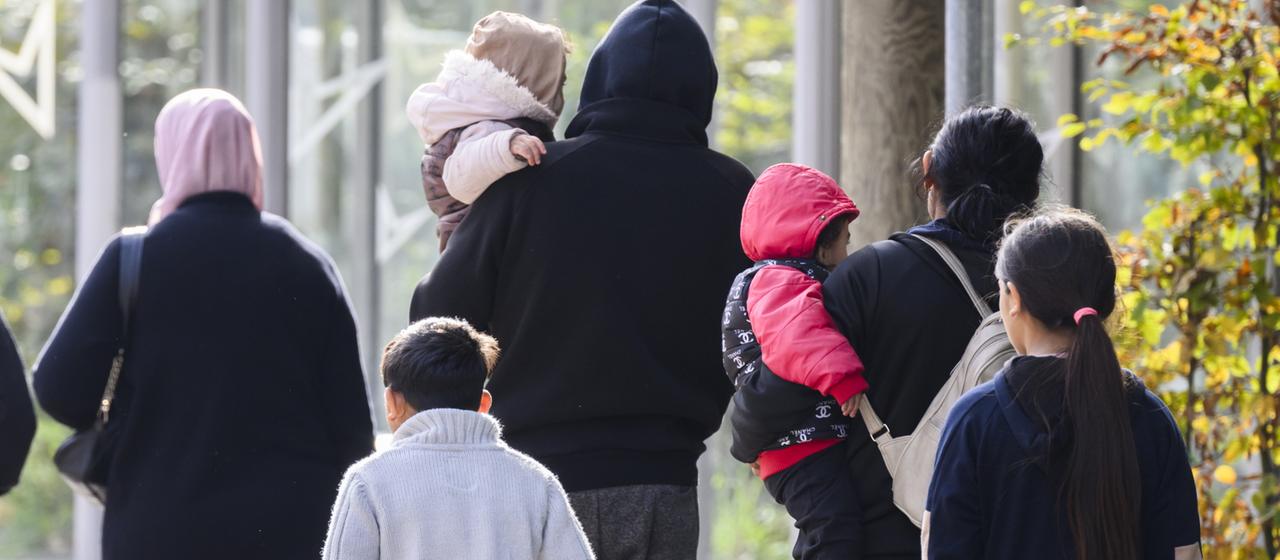 Asylum seekers leave the Lower Saxony state reception authority at the Braunschweig location.