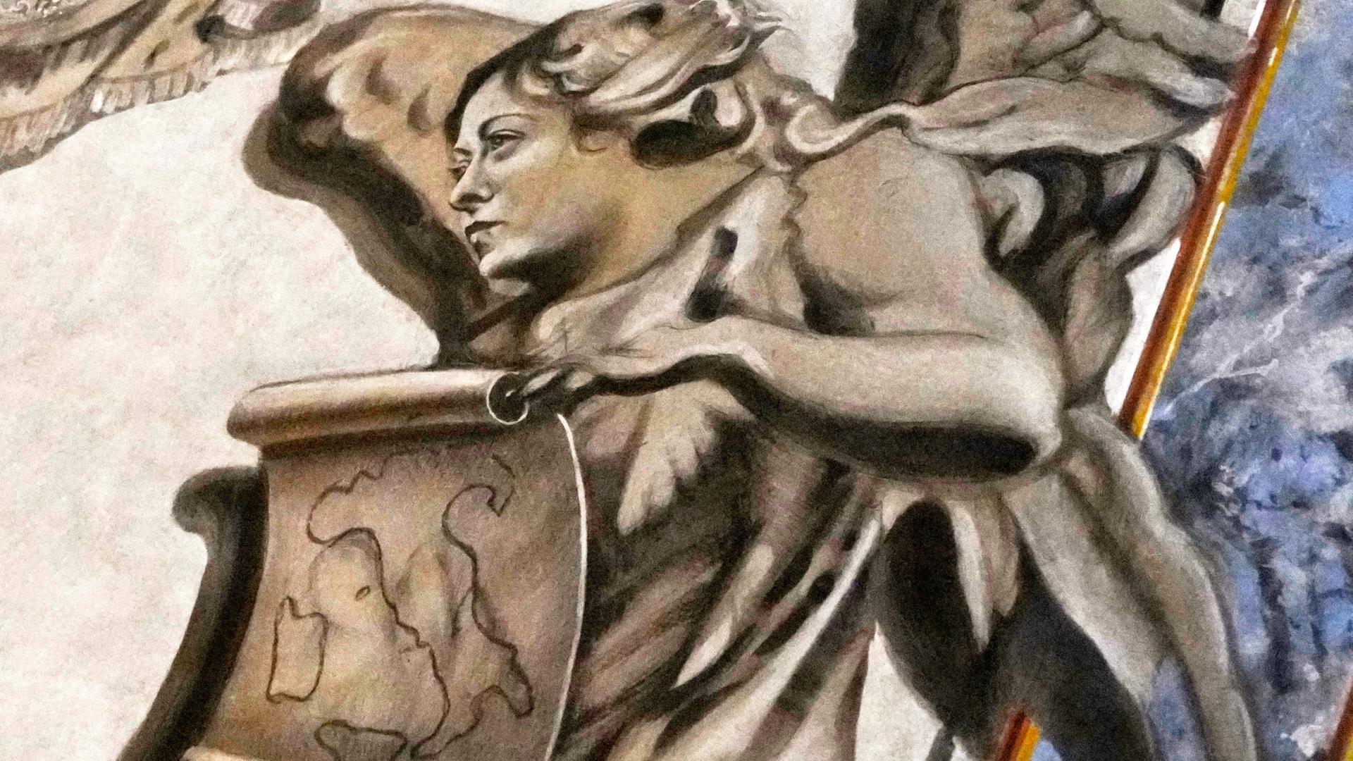 Ein Fresko zeigt einen Engel, der eine Karte von Italien hält. Seine Gesichtszüge ähneln denen von Giorgia Meloni. | AP