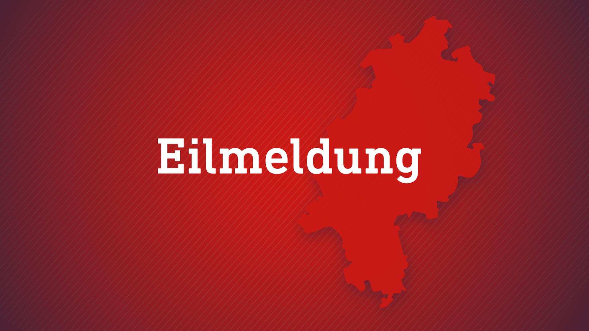 Auf einem rotem Hintergund mit einer Hessenkarte steht das Wort 