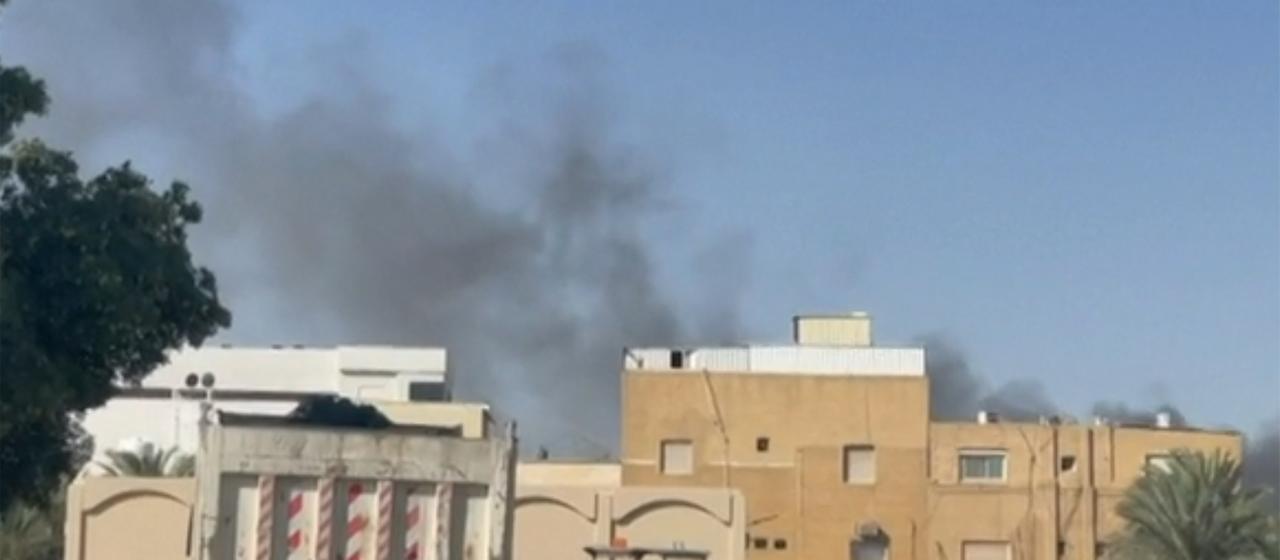 Smoke rises over the US Embassy in Kuwait City.