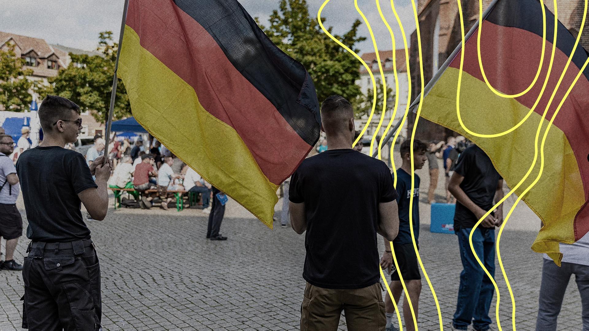 Mitglieder der Jungen Alternative, der Nachwuchsorganisation der AfD, schwenken auf einer Wahlkampfveranstaltung der AfD Brandenburg in Cottbus Deutschlandfahnen. | picture alliance/dpa, Frank Hammerschmidt