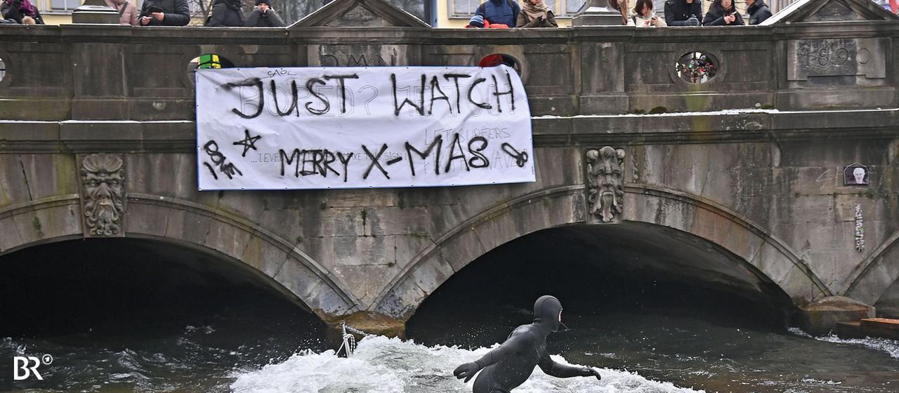 Am 26.12.2025 surfen bereits wieder zahlreiche Surfer die beruehmte Eisbachwelle, die wochenlang verschwunden war.