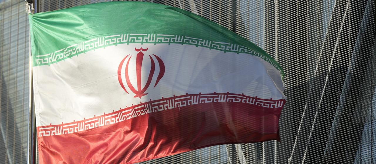 The Iranian national flag blows in the wind.