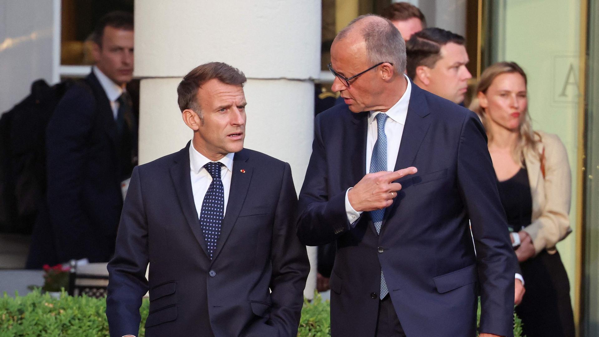 Emmanuel Macron und Friedrich Merz | AFP