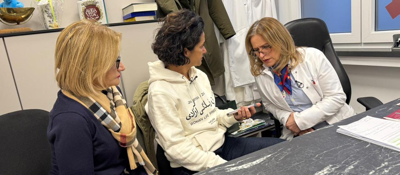 Shabnam Fahimi-Weber and her colleagues look at the findings of an injured person from Iran.