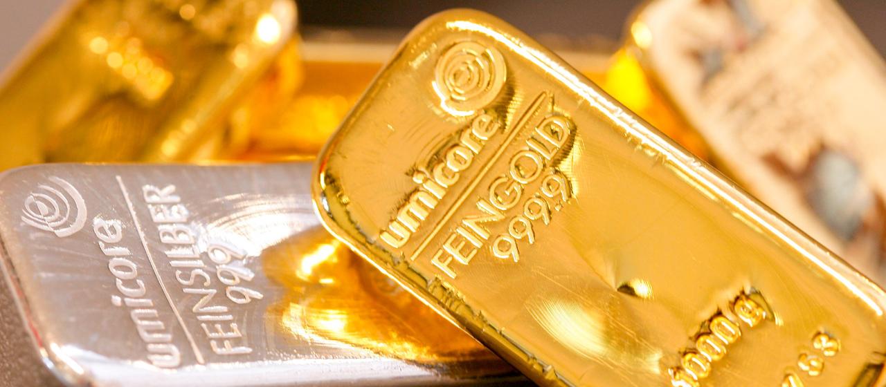 1000g Feingoldbarren und 1000g Feinsilberbarren.